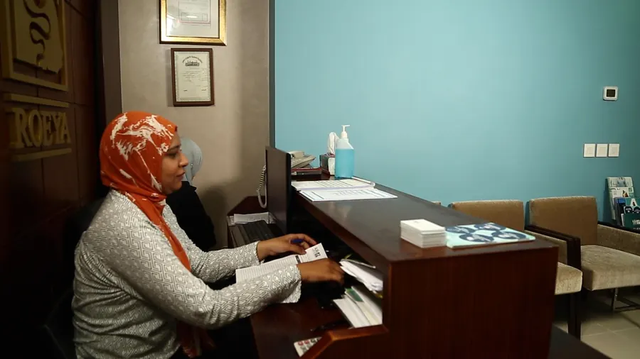 The receptionist at the front desk