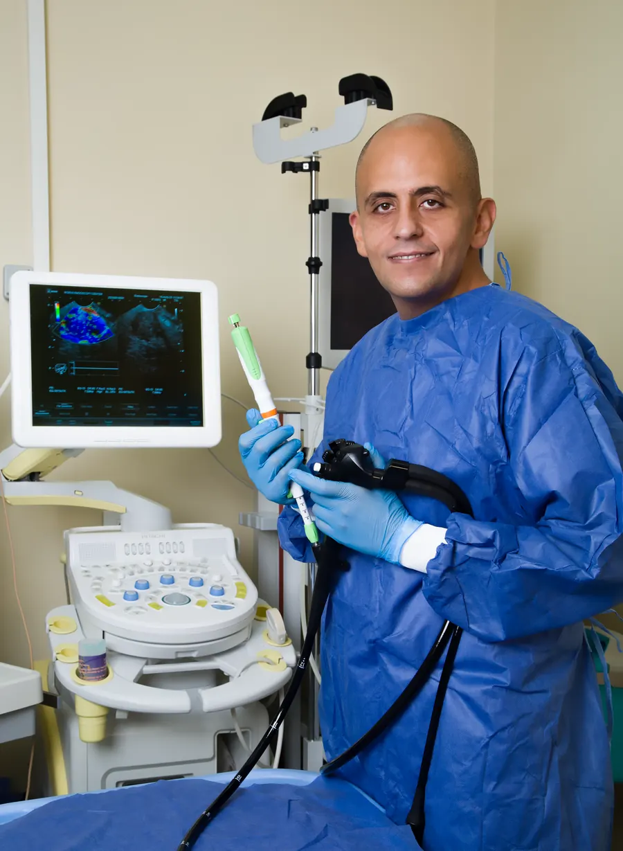 An endoscopist holding an endoscope